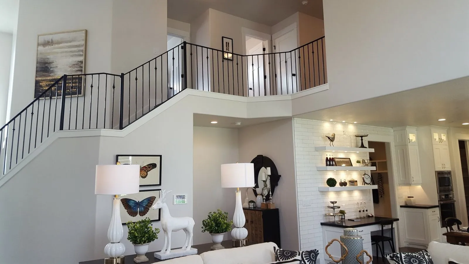 Custom iron stair railing and open foyer — B&N Construction